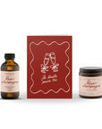 Ensemble de trois produits Rose et Champagne avec une bougie parfumée, un bain moussant et une carte.