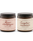 Ensemble de deux bougies parfumées : Rose et Champagne et Camphre et Cachemire, dans des contenants en verre